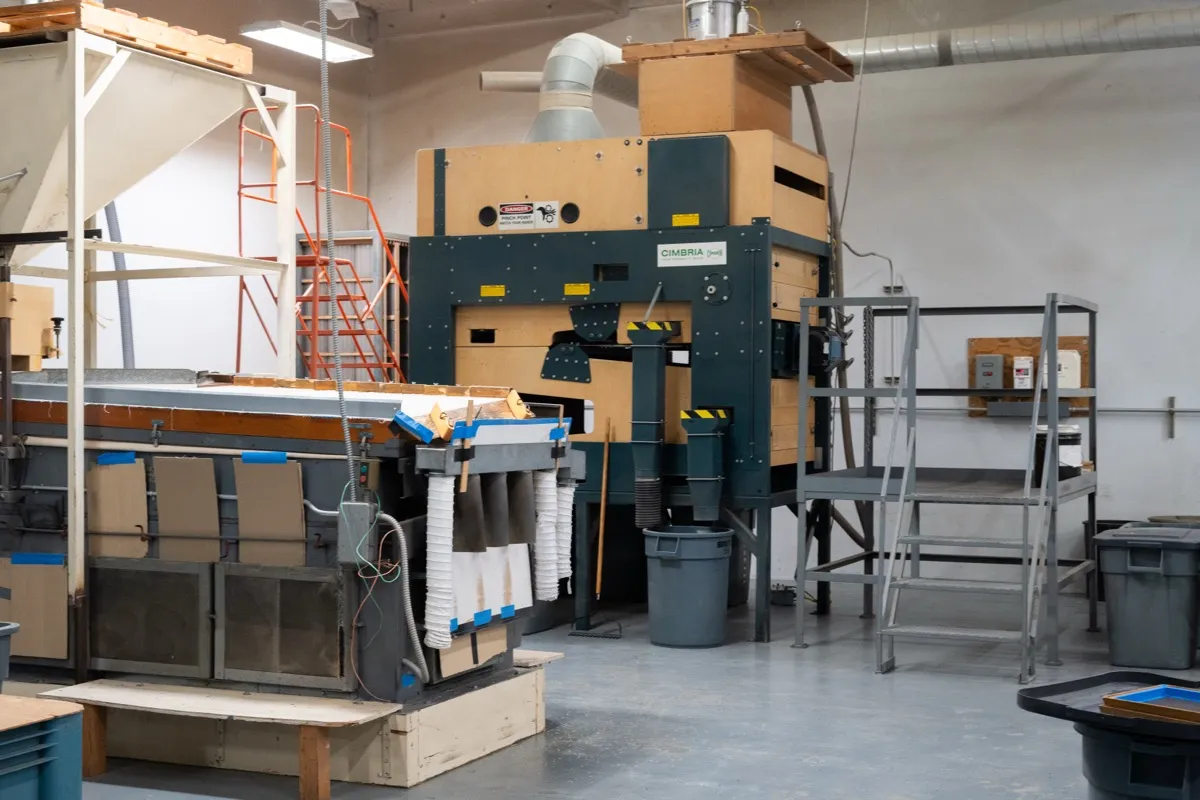 Orsetti Seeds milling floor — multiple machines set up for a processing run